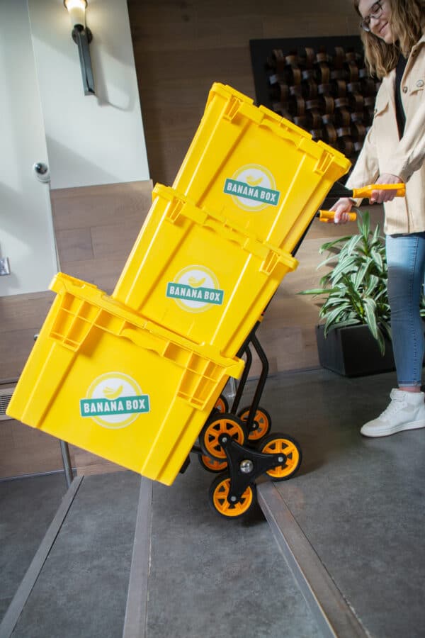 3 reusable boxes on a dolly from Banana Box